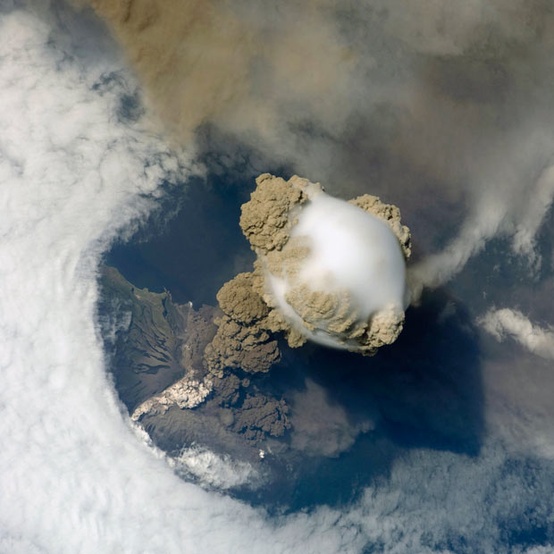 Photo:  large plume of smoke, steam and ash erupting from the Sarychev volcano on the Kuril Islands, Russia